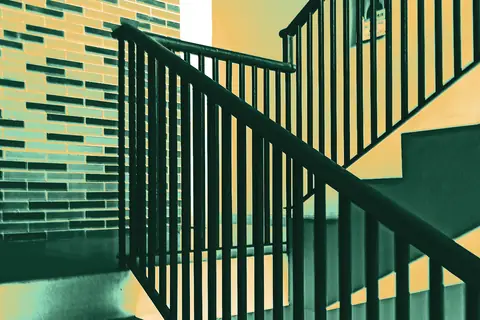 Staircase with a metal railing in an apartment building